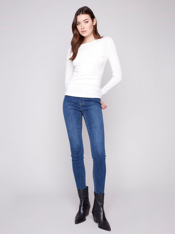 Timeless ecru long sleeve knit top with a flattering slim fit silhouette by Charlie B.