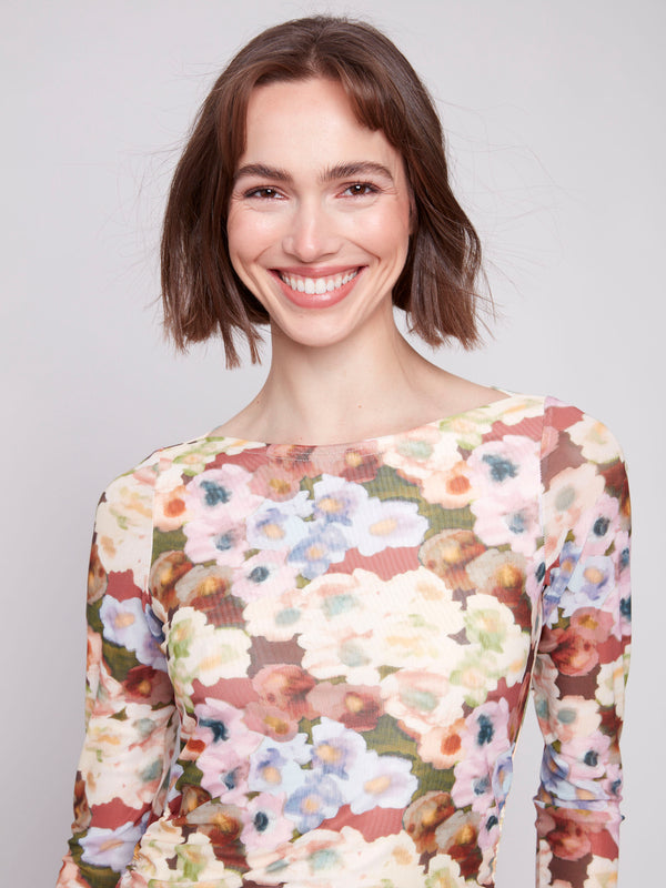 Elegant floral top with long sleeves, perfect for layering in cooler weather by Charlie B.