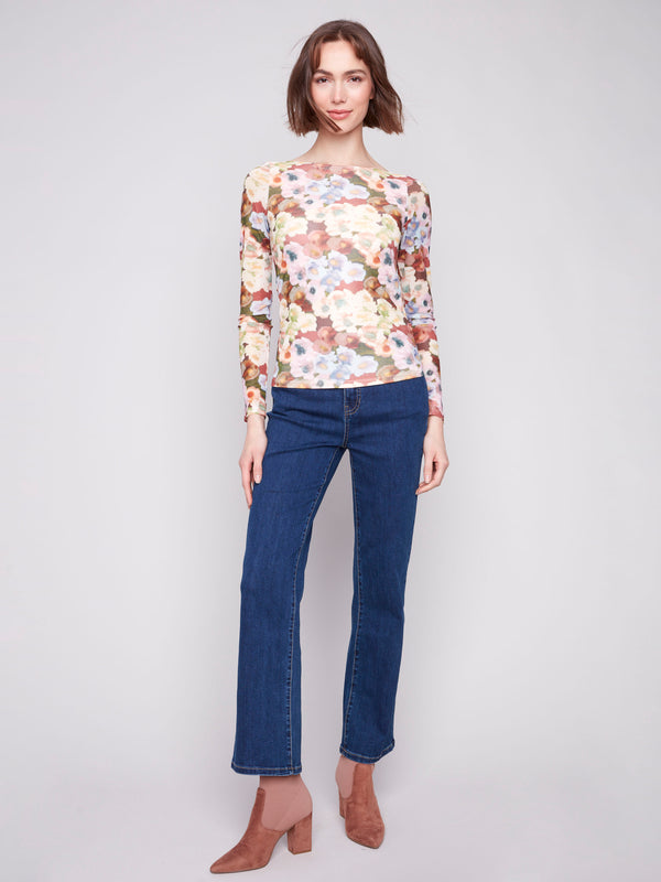 Botanical printed mesh top with ruching at the sides, long sleeves, and a boat neckline by Charlie B.