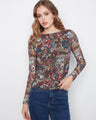 Floral pattern top with a boat neckline, perfect for adding elegance to your wardrobe. The vibrant design is eye-catching by Charlie B.