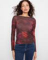This top features a sophisticated boat neckline, perfect for a chic and elegant look by Charlie B.