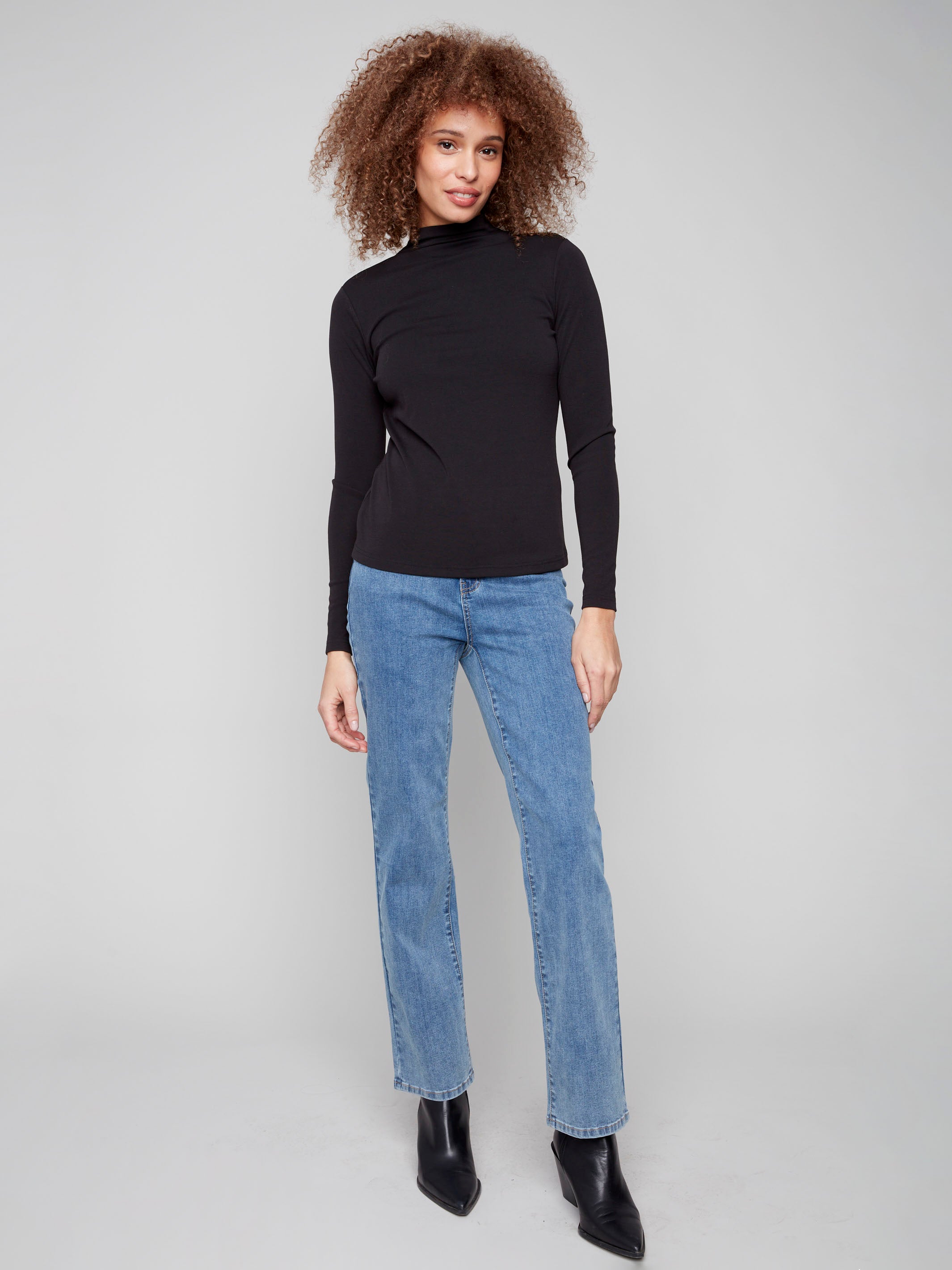 Elegant black top with a mock neck design and fine ribbed texture, offering a sophisticated look by Charlie B.