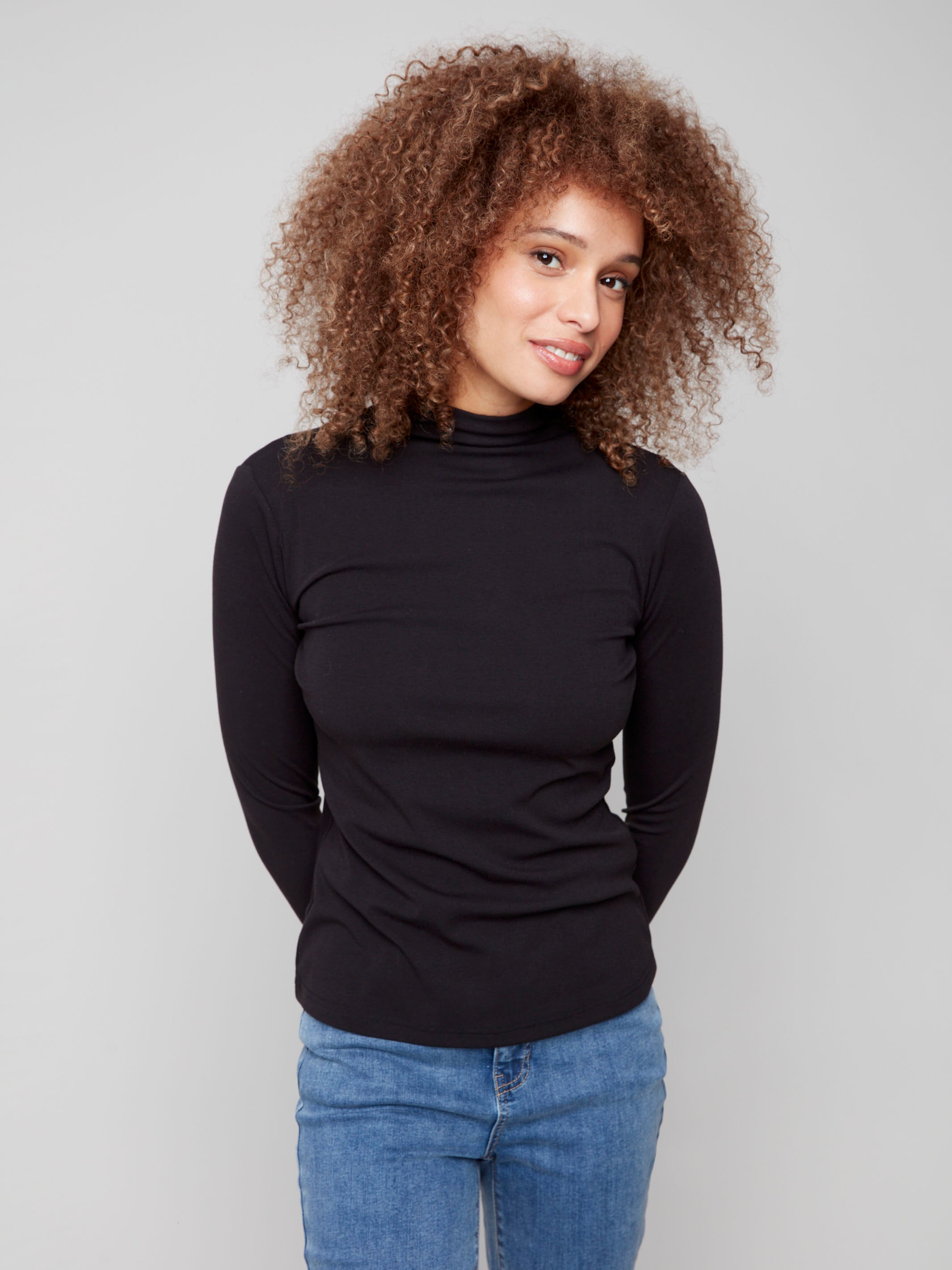 Stylish black long-sleeve top with a flattering slim fit and comfortable fabric by Charlie B.