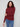 Elegant cabernet top featuring long sleeves and a sleek design by Charlie B.
