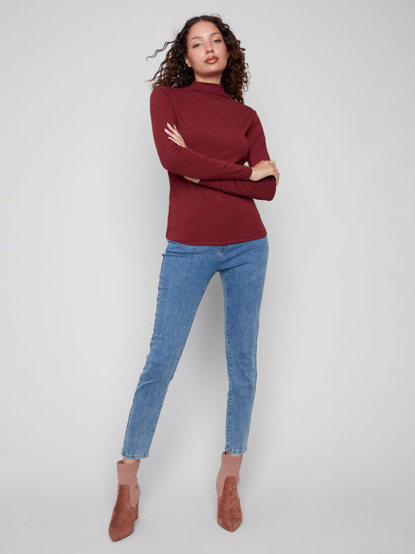 Chic mock neck cabernet top crafted with attention to detail by Charlie B.