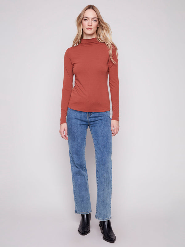 Elegant sepia mock neck top showcasing its fine ribbed texture, ideal for any occasion. A stylish choice by Charlie B.