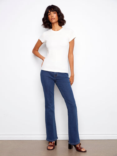 This white T-shirt highlights a ribbed texture, adding subtle detail to its minimalist style by Charlie B.