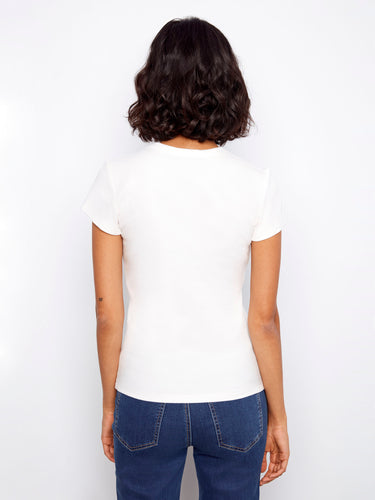 Simple yet stylish, this white shirt comes with a crew neck for timeless appeal by Charlie B.