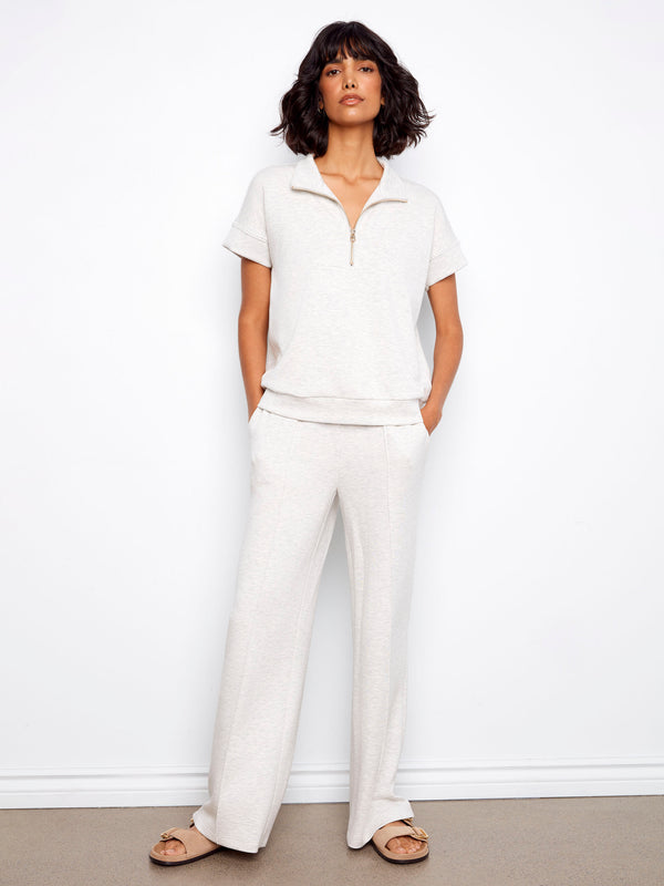 Designed with practical slash pockets, these pants combine style and functionality effortlessly. By Charlie B.