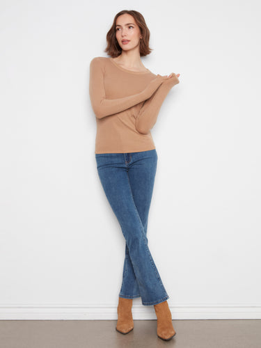 Stylish beige top showcasing a ribbed texture that adds subtle detail to the design, perfect for layering by Charlie B.