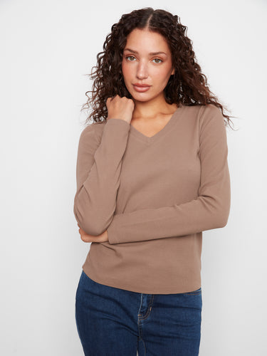 Enjoy the slim fit design that enhances your silhouette effortlessly. A versatile piece crafted by Charlie B.