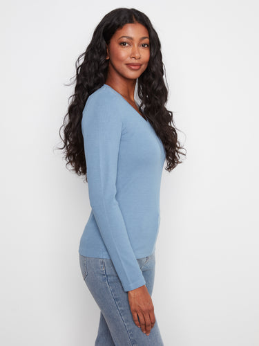 Stylish blue ribbed top in a breathable fabric blend, perfect for versatile layering and everyday wear by Charlie B.
