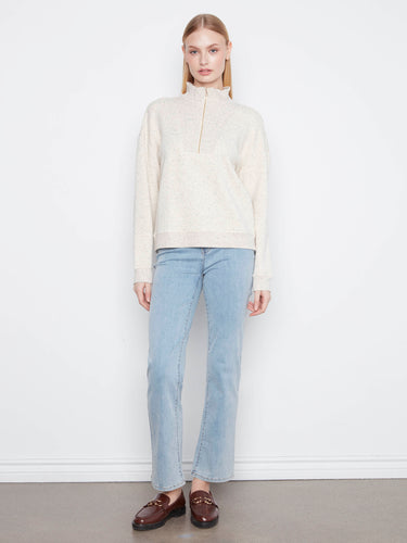 A half-zip mock neck adds versatility to this classic design, allowing you to adjust your look effortlessly. By Charlie B.