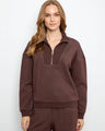 Half-zip mock neck adds stylish versatility to this piece by Charlie B.