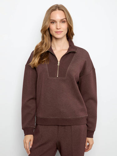 Half-zip mock neck adds stylish versatility to this piece by Charlie B.