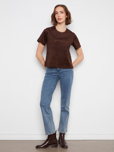 This top showcases a straight fit, providing a sleek silhouette that flatters all body types. By Charlie B.