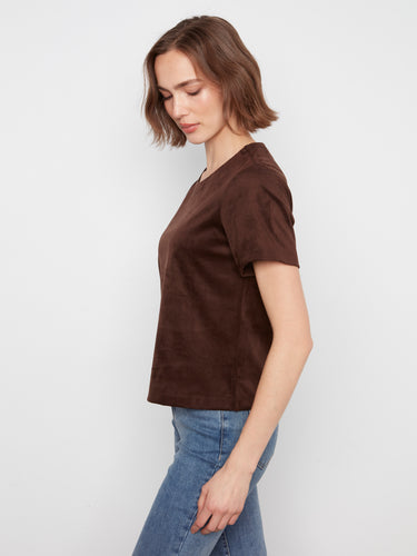 Stylish piece with a side slit detail, adding an element of modern flair to the design. By Charlie B.