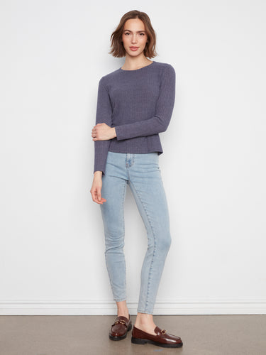 This long-sleeved shirt combines elegance with practicality, ideal for cooler days. By Charlie B.