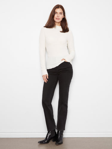 Crafted with bubble knit texture, this top offers both comfort and style. Its slim fit ensures a flattering silhouette by Charlie B.