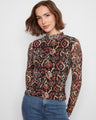 Elegant top with a mock neckline, showcasing intricate patterns for a chic look by Charlie B.
