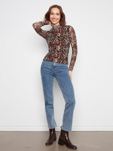 Stylish long sleeves enhance the sophisticated design of this vibrant patterned top by Charlie B.