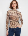 The top features a mock neckline, adding a sophisticated touch to the design by Charlie B.