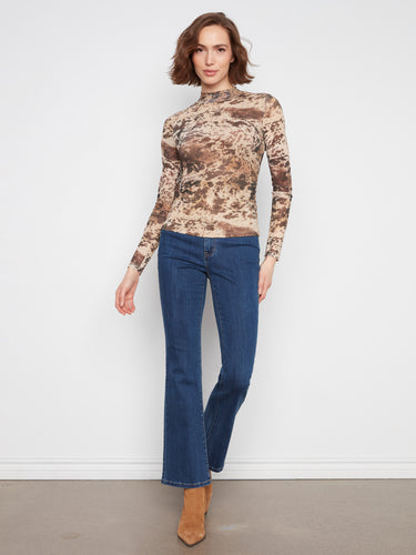 Made from stretch mesh fabric, this top ensures a flexible fit while maintaining elegance by Charlie B.