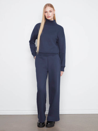 These full-length pants have zip side pockets, blending functionality with fashion in a sleek cotton blend fabric by Charlie B.