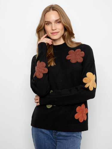 Sweater featuring a crew neckline and eye-catching floral appliqué embroidery for a stylish touch by Charlie B.