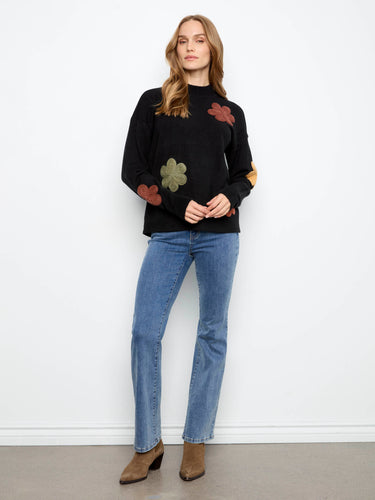 Chic sweater with ribbed hem cuffs and vibrant floral designs, perfect for casual elegance by Charlie B.