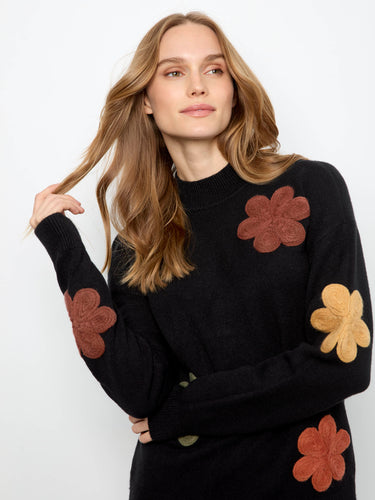 Elegant sweater showcasing colorful floral appliqué embroidery that stands out beautifully by Charlie B.