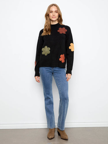 This fashionable piece features a crew neckline, ideal for layering or wearing solo in any season by Charlie B.