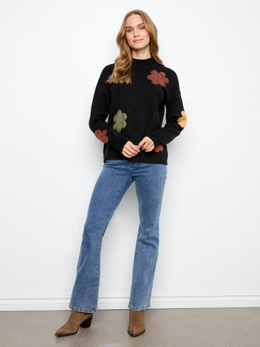 Adorned with unique floral appliqués, this sweater brings artistic flair to everyday wear effortlessly by Charlie B.