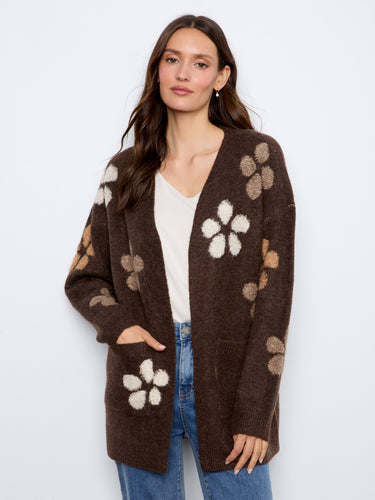 Featuring practical patch pockets, this cardigan combines functionality with fashion effortlessly. By Charlie B.