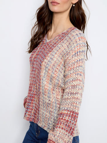 Crafted from novelty yarn, this sweater offers an eye-catching pattern with long sleeves. By Charlie B.