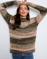 Cozy sweater with a mock neckline, featuring a rich blend of earthy tones for a warm look. By Charlie B.
