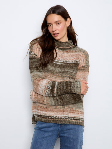 Stylish high-low hem adds flair to this soft and textured sweater, perfect for layering. By Charlie B.