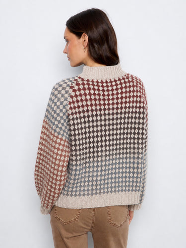 Beautifully crafted with attention to detail, this sweater combines style and comfort effortlessly. By Charlie B.