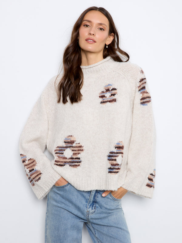 This sweater features a cozy mock neck design, perfect for chilly days. Its soft texture adds comfort and style by Charlie B.