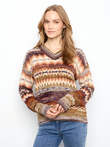 This sweater features a stylish V-neckline with a vibrant, multicolored pattern, perfect for adding flair to any outfit by Charlie B.