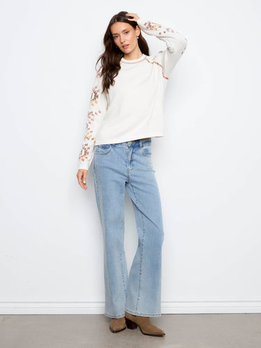 The raglan sleeves provide a relaxed fit and enhance the casual elegance of this knitwear. By Charlie B.