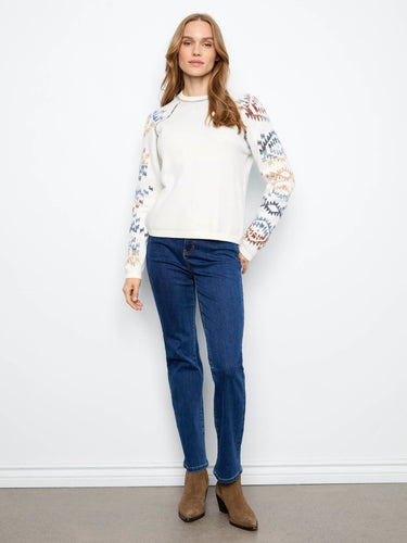 With its unique pattern and crew neckline, this piece adds flair to any wardrobe by Charlie B.
