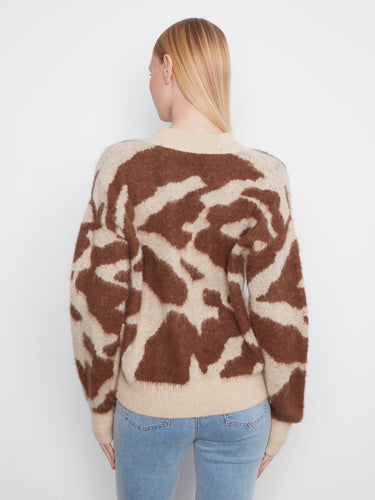 V-neck design enhances the classic look of this comfortable, stylish cardigan. By Charlie B.