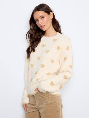 The cozy fabric with heart patterns offers both style and warmth, making it a must-have item. By Charlie B.