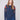 Heather denim sweater with crew neckline and vibrant floral details on sleeves by Charlie B.