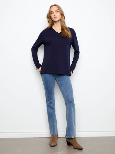 This elegant sweater boasts long sleeves, offering warmth and style for any occasion. By Charlie B.