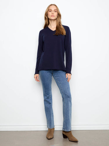 Crafted from a soft knit material, this piece delivers coziness without compromising on elegance. By Charlie B.