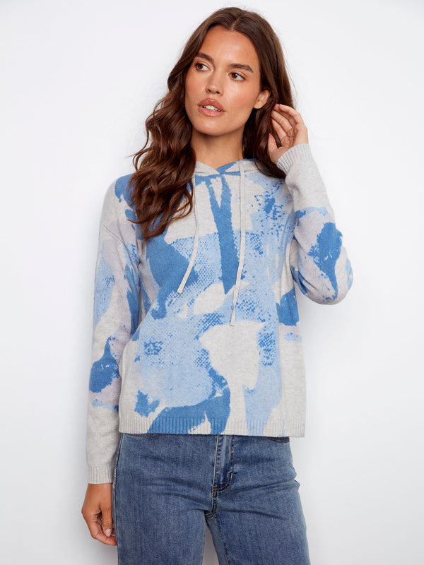 Blue abstract printed hoodie sweater featuring a hood with drawstrings, creating a casual look by Charlie B.