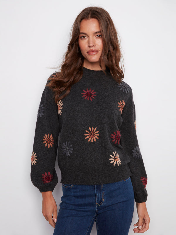 Charcoal sweater with floral embroidery and a cozy mock neck, featuring a drop shoulder design by Charlie B.