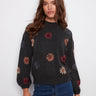 Charcoal sweater with floral embroidery and a cozy mock neck, featuring a drop shoulder design by Charlie B.